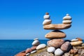 Concept of harmony and balance. Balance and poise stones against the sea. Rock zen in the form of scales