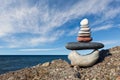 Concept of harmony and balance. Rock Zen on the background of summer sea. Royalty Free Stock Photo