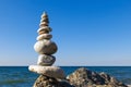 Concept of harmony and balance. Rock Zen on the background of summer sea. Royalty Free Stock Photo