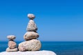 Concept of harmony and balance. Rock Zen on the background of summer sea. Royalty Free Stock Photo