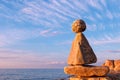 Concept of harmony and balance. Rock Zen at sunset. Royalty Free Stock Photo