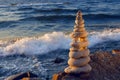 Concept of harmony and balance. Rock Zen at sunset. Balance and poise stones against the sea. Royalty Free Stock Photo