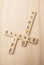 Balance of work and life by wooden crossword