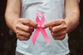 concept healthcare and medicine. hand holding pink ribbon. breast cancer awareness. sign of hope