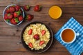 The concept of a healthy diet: cornflakes, strawberries, a glass Royalty Free Stock Photo