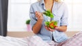 Concept of healthy eating. happy woman eating vegetable vegetarian salad