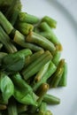 Concept of healthy food. Boiled asparagus with basil on white plate. Close up view Royalty Free Stock Photo