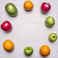 Concept of healthy food, vitamins, various fruits, various apples, mangoes, oranges lined frame place text wooden rustic b