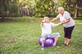 Concept of healthy lifestyle - pensioner man and woman doing tog Royalty Free Stock Photo