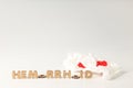 Concept of hemorrhoids with wooden letters on white background