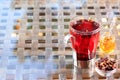 Concept of herbal tea. Hibiscus tea in a glass mug with honey. H Royalty Free Stock Photo