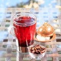 Concept of herbal tea. Hibiscus tea in a glass mug with turkish Royalty Free Stock Photo