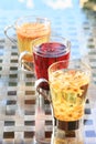 Concept of herbal tea. Variety of herbal teas in glass mugs. Healthy caffein-free drinks. Chamomile, hibiscus and linden teas in Royalty Free Stock Photo