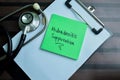 Concept of Hidradenitis Suppurativa write on sticky notes with stethoscope isolated on Wooden Table Royalty Free Stock Photo