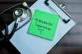 Concept of Hidradenitis Suppurativa write on sticky notes with stethoscope isolated on Wooden Table