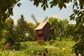 Concept of historical buildings of ancient Ukraine. Astonishing landscape with ancient wooden windmill