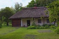 Concept of historical buildings in ancient Ukrainian village. Reconstruction of an ancient clay house with front yard Royalty Free Stock Photo