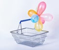 Concept of holiday or festive sale empty metal shopping basket w