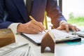 Concept home purchase contract,Businessmen are signing a house p Royalty Free Stock Photo