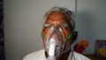 Concept home quarantine, prevention COVID-19 or Coronavirus outbreak situation. Aged man suffering from Covid 19 disease