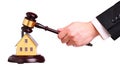 Concept of house sale with gavel in hand Royalty Free Stock Photo