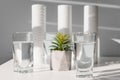 Concept Household filtration system. water treatment concept. use of water filters at home. Glasses of clean water and filters on Royalty Free Stock Photo