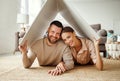 Concept housing  young family couple.  man and woman under fake roof in  new home Royalty Free Stock Photo