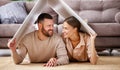 Concept housing  young family couple.  man and woman under fake roof in  new home Royalty Free Stock Photo