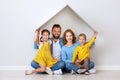 Concept housing a young family. mother father and children in  new home Royalty Free Stock Photo