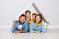 Concept housing a young family. mother father and children in  new home Royalty Free Stock Photo