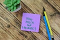 Concept of How Much Can I Release? write on sticky notes isolated on Wooden Table Royalty Free Stock Photo