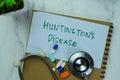 Concept of Huntington`s Disease write on sticky notes isolated on Wooden Table