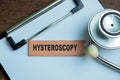 Concept of Hysteroscopy write on sticky notes with stethoscope isolated on Wooden Table Royalty Free Stock Photo