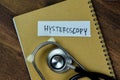 Concept of Hysteroscopy write on sticky notes with stethoscope isolated on Wooden Table Royalty Free Stock Photo