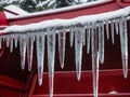 Icicles On A Red Sler. Generative AI Royalty Free Stock Photo