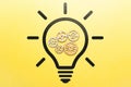 Concept idea and its development. Icon of a light bulb and working gears.