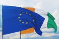 Waving European Union flag and flag of Cote Ivoire. Closeup view, 3D illustration.