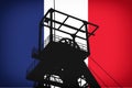 Concept Illustration With French Flag in the Background And Coal Mine Ferris Wheel SIlhouette in the foreground