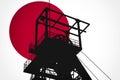 Concept Illustration With Japanese Flag in the Background And Coal Mine Ferris Wheel SIlhouette in the foreground