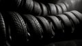 New tires pile on a dark background. Tyre fitting background. Stock of car tires. Generative AI Royalty Free Stock Photo