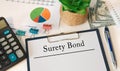 Concept image for blog headline or header image. Surety Bond inscription on paper Royalty Free Stock Photo