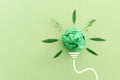 Concept image if green crumpled paper lightbulb, symbol of scr, innovation and eco friendly business