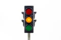 Amber traffic light isolated on a white background.
