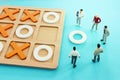 Concept image of miniature people solving puzzle. idea of teamwork and success Royalty Free Stock Photo