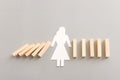 Concept image of stopping the domino effect. A female figure blocks falling cubes. Risk, success, and problem solving Royalty Free Stock Photo