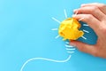 Concept image of successful idea, crumpled paper and light bulb sketch, brainstorming and creative thinking Royalty Free Stock Photo