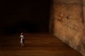 A concept image of a woman who facing a dead end and has a wall in front of her. An idea of overcoming fear and obstacle