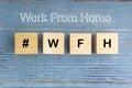 Concept image a wooden block and word - #WFH  WORK FROM HOME Royalty Free Stock Photo