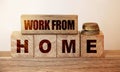 Concept image a wooden block and word - WORK FROM HOME on wooden background. WFH . Selective focus Royalty Free Stock Photo