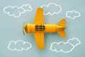 Concept of imagination, creativity, dreaming and childhood. Retro toy plane with info graphics sketch on the blue background